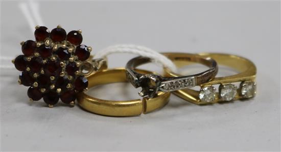 Three assorted dress rings, including 18ct and 9ct and a 22ct gold wedding band.